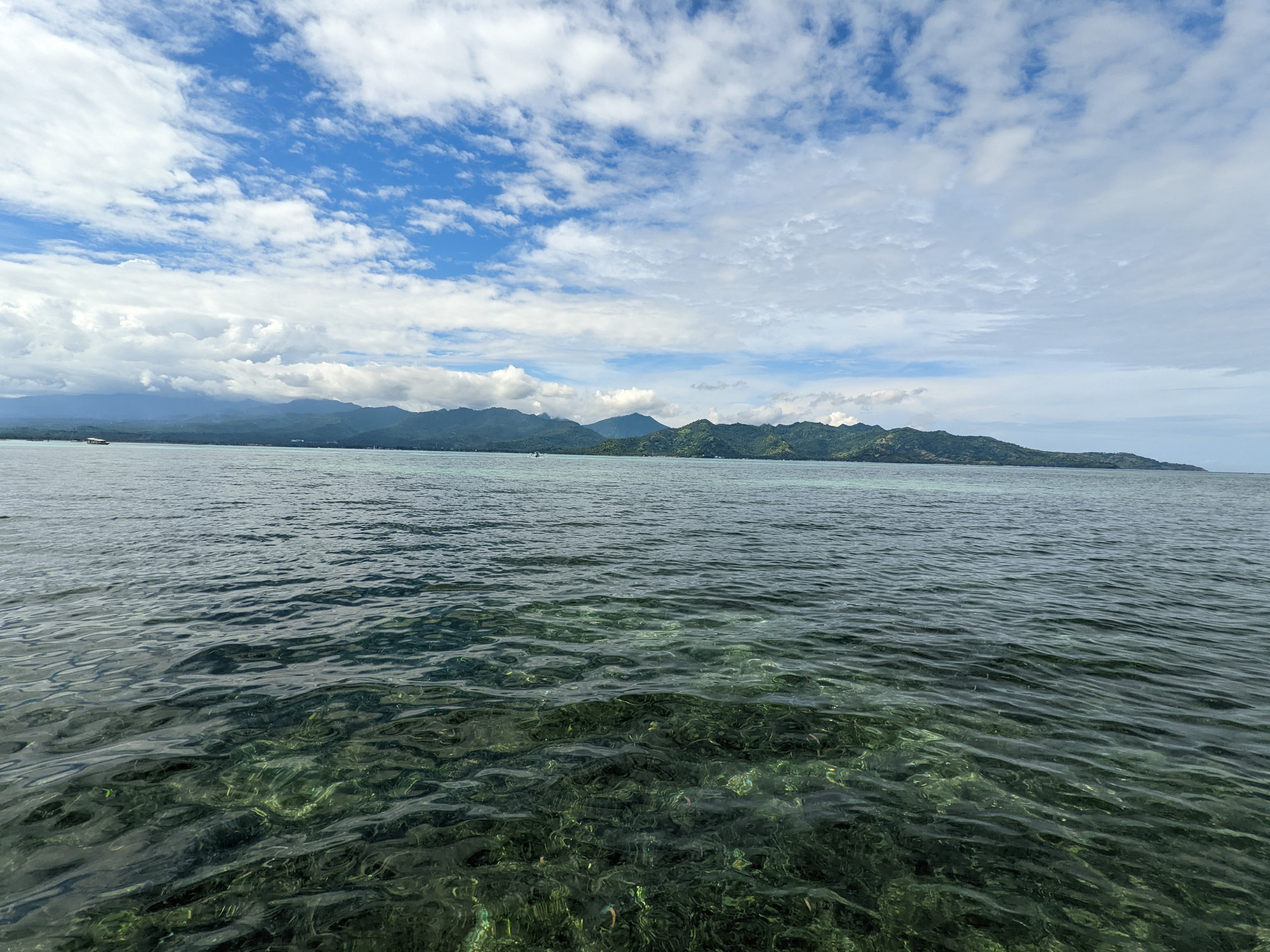 Crystal-clear waters near a tropical island